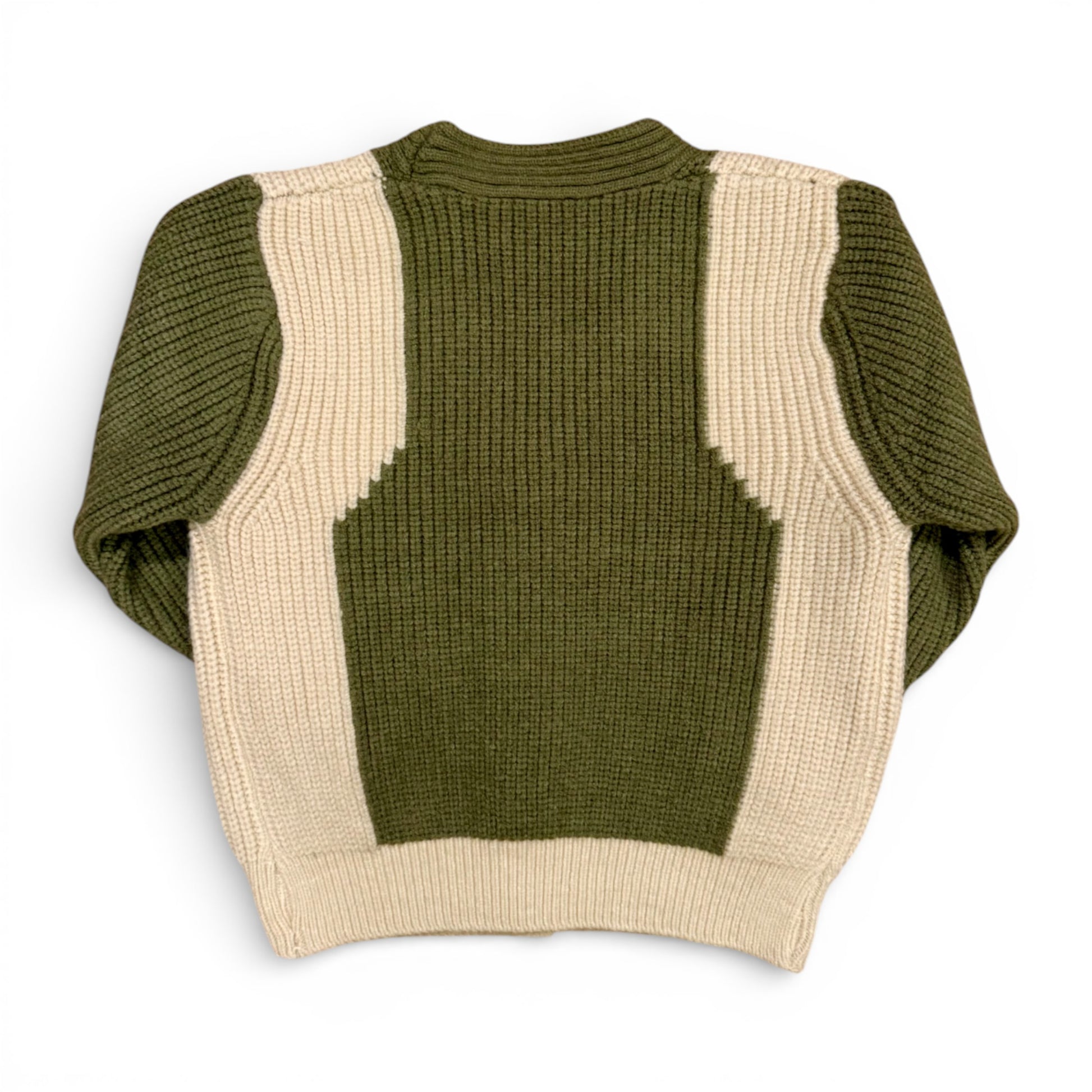 Detail of contrast knit panels on olive green children’s jumper