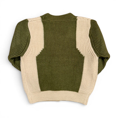 Detail of contrast knit panels on olive green children’s jumper