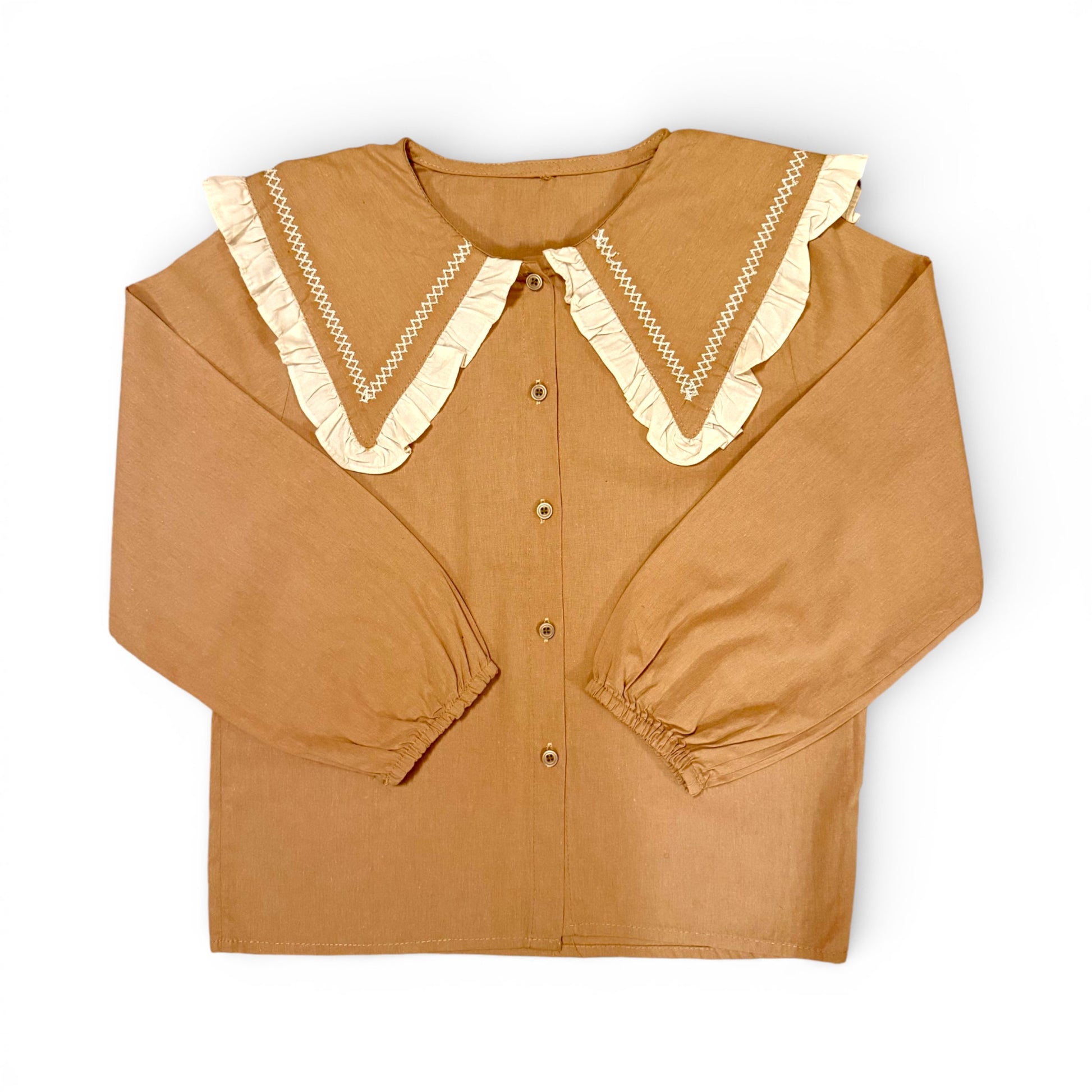 Children’s terracotta organic cotton blouse with oversized sailor collar, embroidered detailing, drop shoulders and cropped wide sleeves.