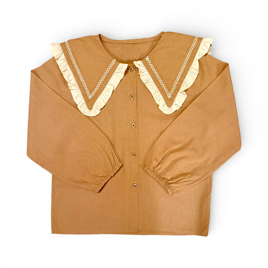 Children’s terracotta organic cotton blouse with oversized sailor collar, embroidered detailing, drop shoulders and cropped wide sleeves.