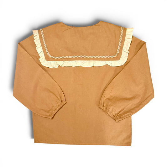 Children’s terracotta organic cotton blouse with oversized sailor collar, embroidered detailing, drop shoulders and cropped wide sleeves.