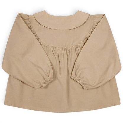 Children’s beige A-line blouse with balloon sleeves, Peter Pan collar and front button detail by That’s Not Fair London