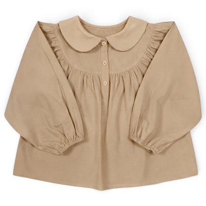 Children’s beige A-line blouse with balloon sleeves, Peter Pan collar and front button detail by That’s Not Fair London