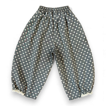 Kehinde Pantaloons in Charcoal Polka Dot – wide-leg cotton denim with lace cuff and elastic waist.