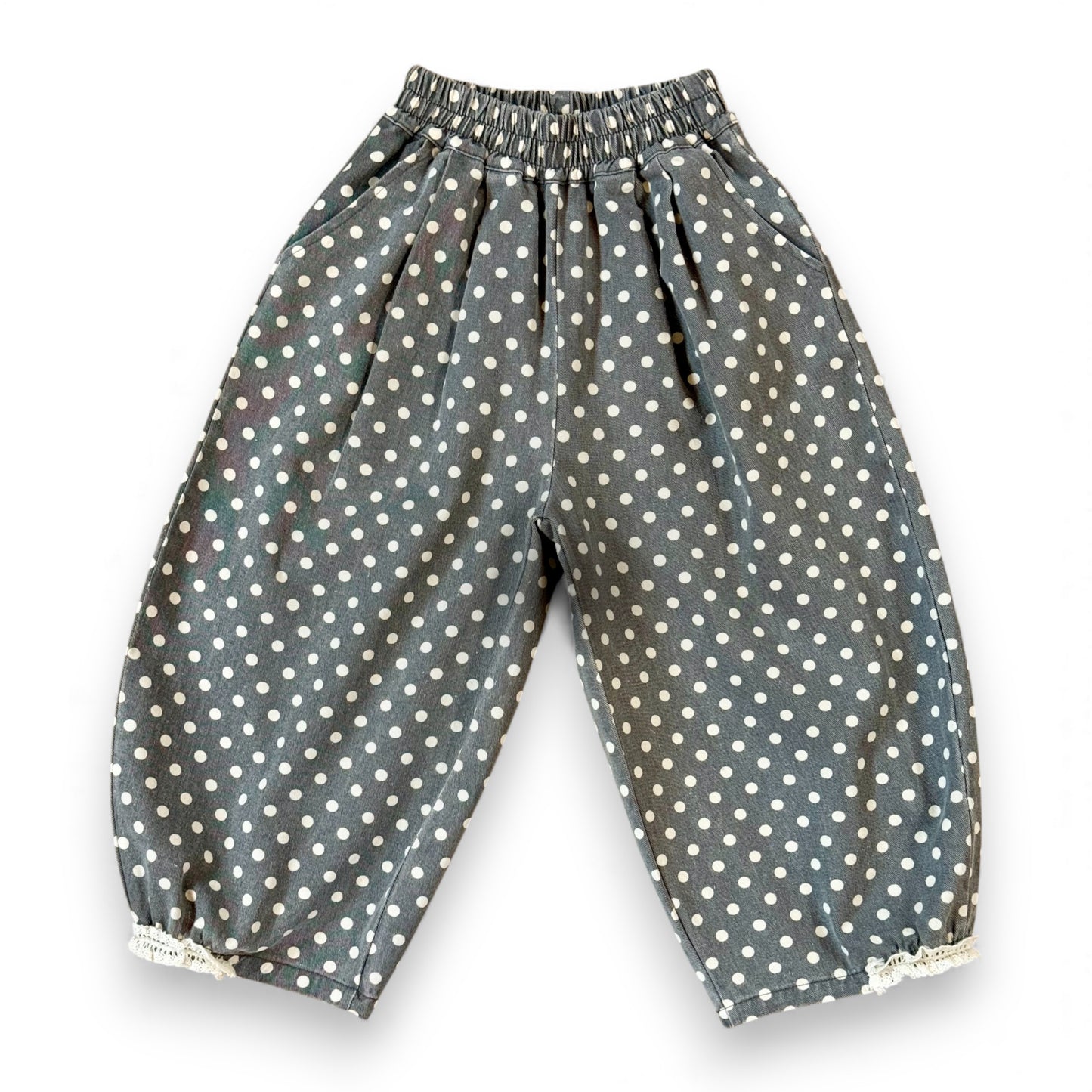 Kehinde Pantaloons in Charcoal Polka Dot – wide-leg cotton denim with lace cuff and elastic waist.