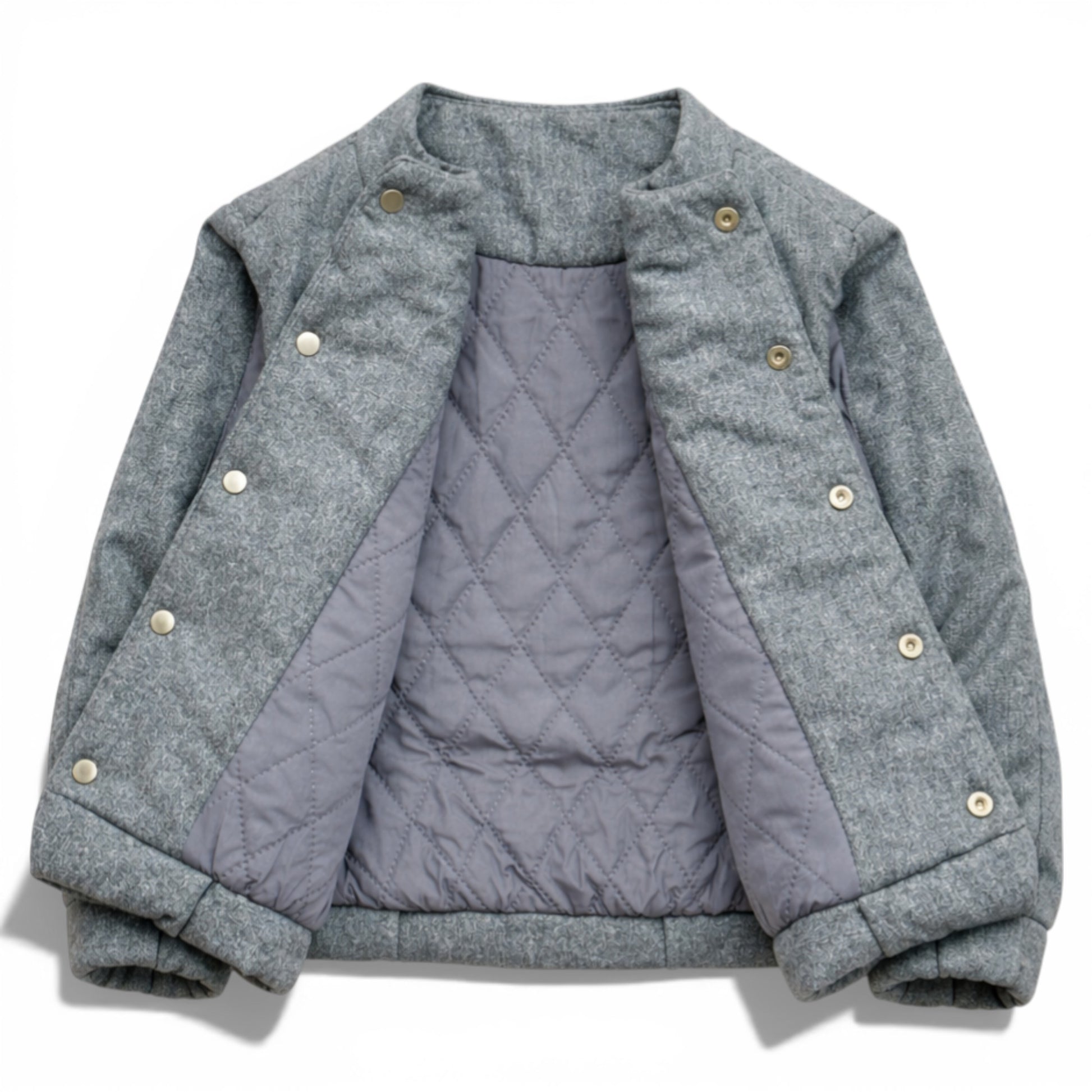 Grey wool kids jacket shown open with quilted lining, snap button placket and elastic hem. Children’s gilet showing diamond-quilted lining and hidden popper fastening 