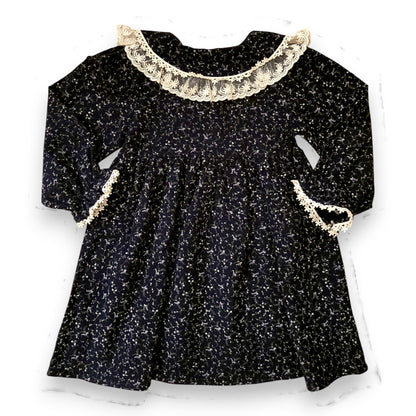 Back view of the Lelija dress by That’s Not Fair London, loose empire line baby dress in navy floral brushed cotton, unlined and softly gathered