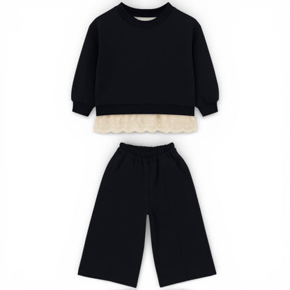 Children’s cotton jersey tracksuit with lace hem sweatshirt and wide straight-leg trousers by That’s Not Fair London