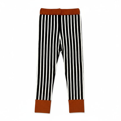 Black and white vertical striped children’s leggings with brown contrast cuffs and waistband