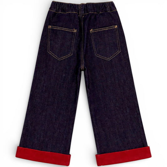 Children’s wide-leg fleece lined denim trousers with elasticated waistband and red turn-up hem
