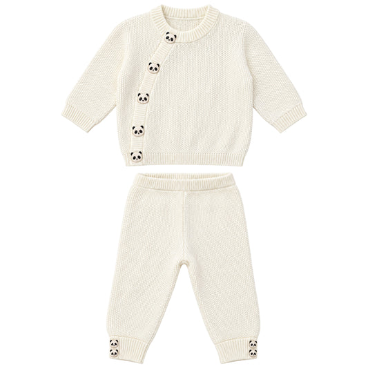 A two-piece baby knit outfit set in cream/off-white, featuring a long-sleeve cardigan top with panda face button details and matching jogger pants with panda cuff accents, displayed on a solid white background.