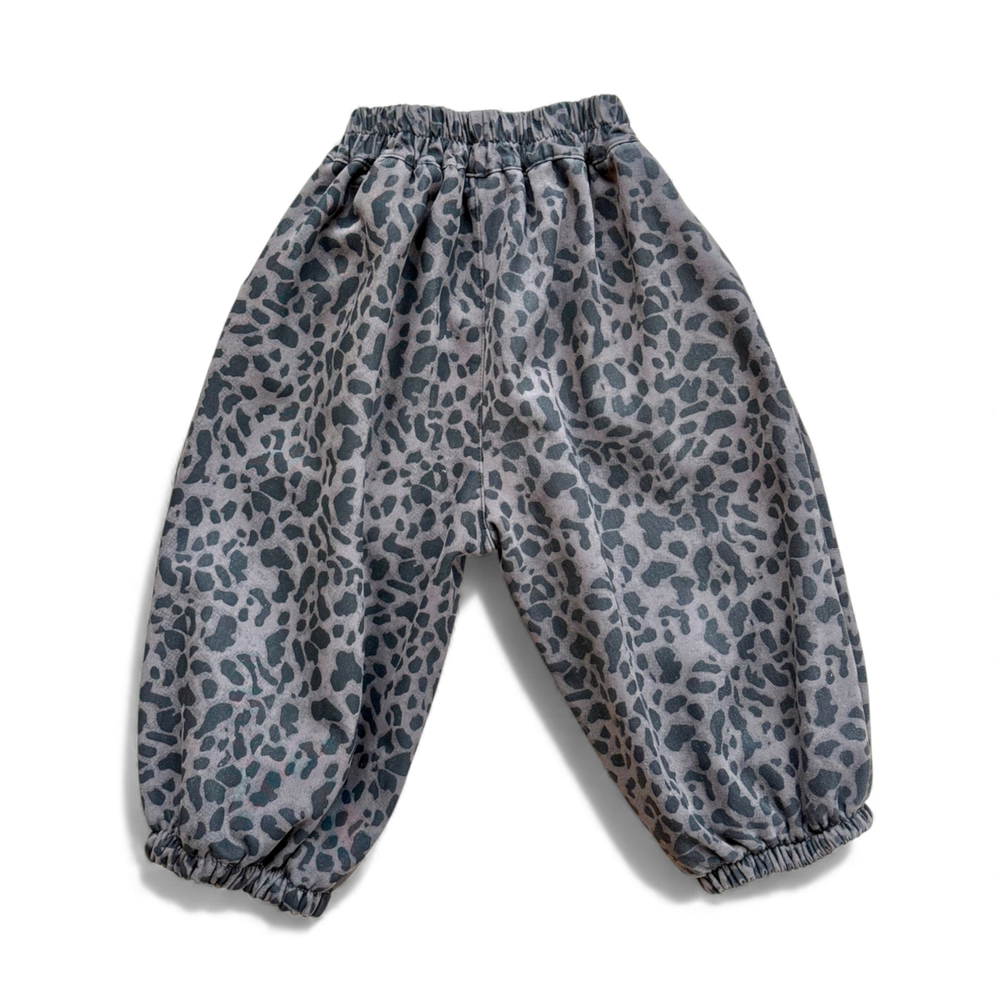 Animal-print children’s balloon pantaloons with high elasticated waist, back yoke, inverted pleats and elasticated cuffs — back view.
