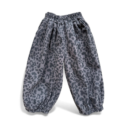 Animal-print children’s pantaloons with high gathered waist, front inverted pleats, scoop pockets and elasticated cuffs — front view.