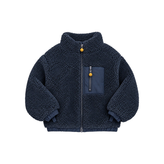 Front view of the Nyima navy sherpa jacket with a high collar, full-length zip, contrasting chest pocket and bobble zip pulls.