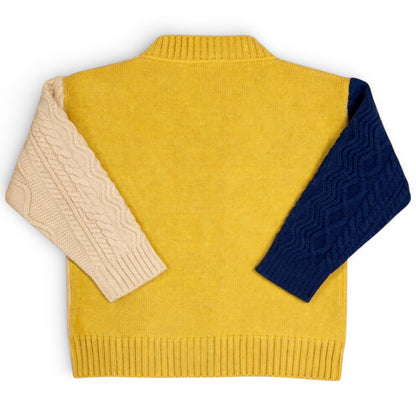 Children’s remnant knit cardigan with cable knit sleeves, plain knit body and ribbed trims by That’s Not Fair London