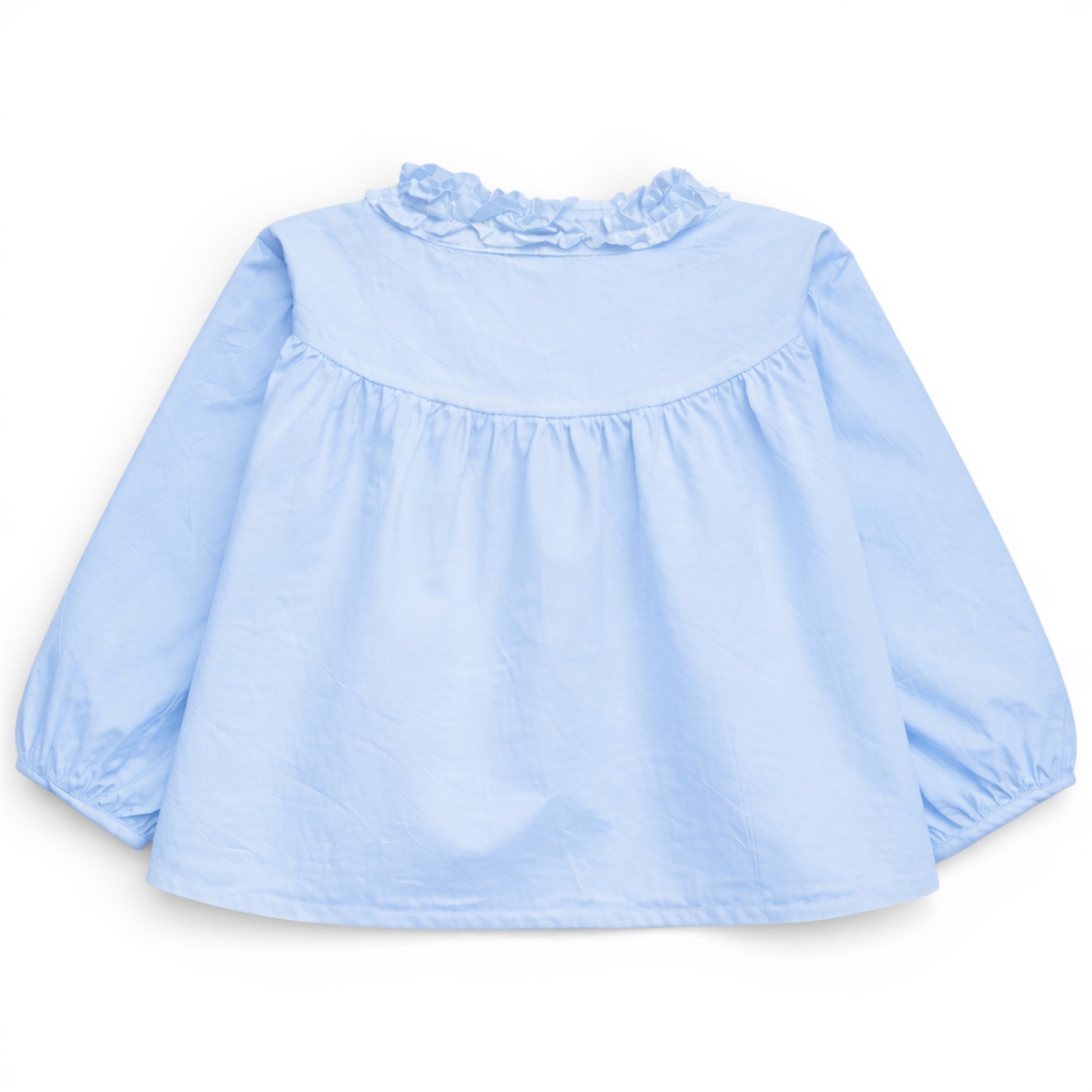 Back view of pale sky blue trapeze cotton blouse with gathered yoke and ruched balloon sleeves, That’s Not Fair London