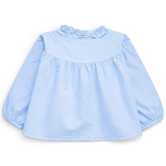 Back view of pale sky blue trapeze cotton blouse with gathered yoke and ruched balloon sleeves, That’s Not Fair London