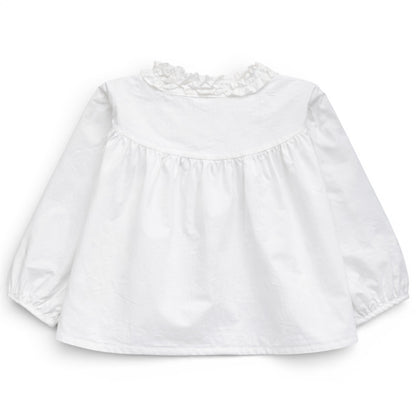 Back view of white trapeze cotton blouse with gathered yoke and ruched balloon sleeves, That’s Not Fair London