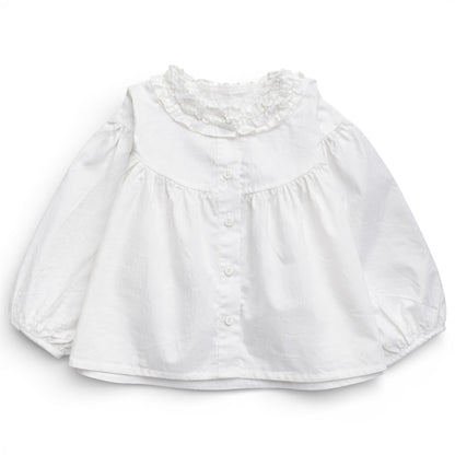 White trapeze cotton blouse for children with dropped shoulder, ruched balloon sleeves and button-front, by That’s Not Fair London