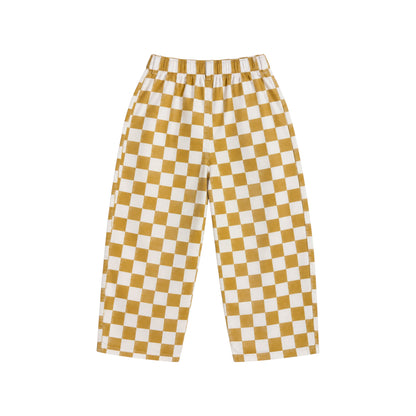 Back view of the Ramsey Pants by That’s Not Fair London in mustard and white check, showing the relaxed leg and back waistband.