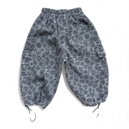 Grey animal-print children’s cargo pants with high elasticated waist, cargo pockets, patch back pocket and drawstring cuffs — back view.
