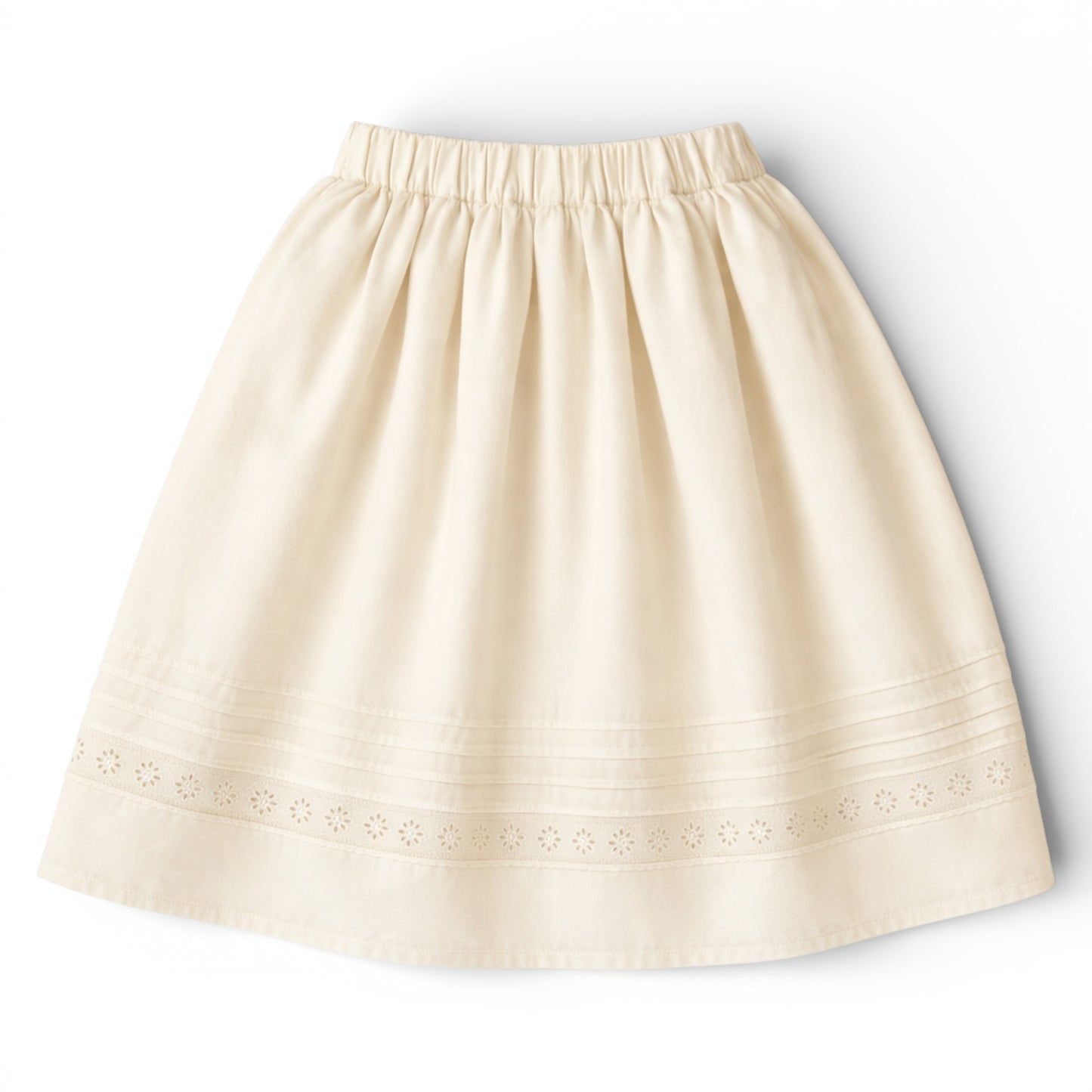 Girls tea‑length cream cotton A‑line skirt with slant pockets and eyelet hem