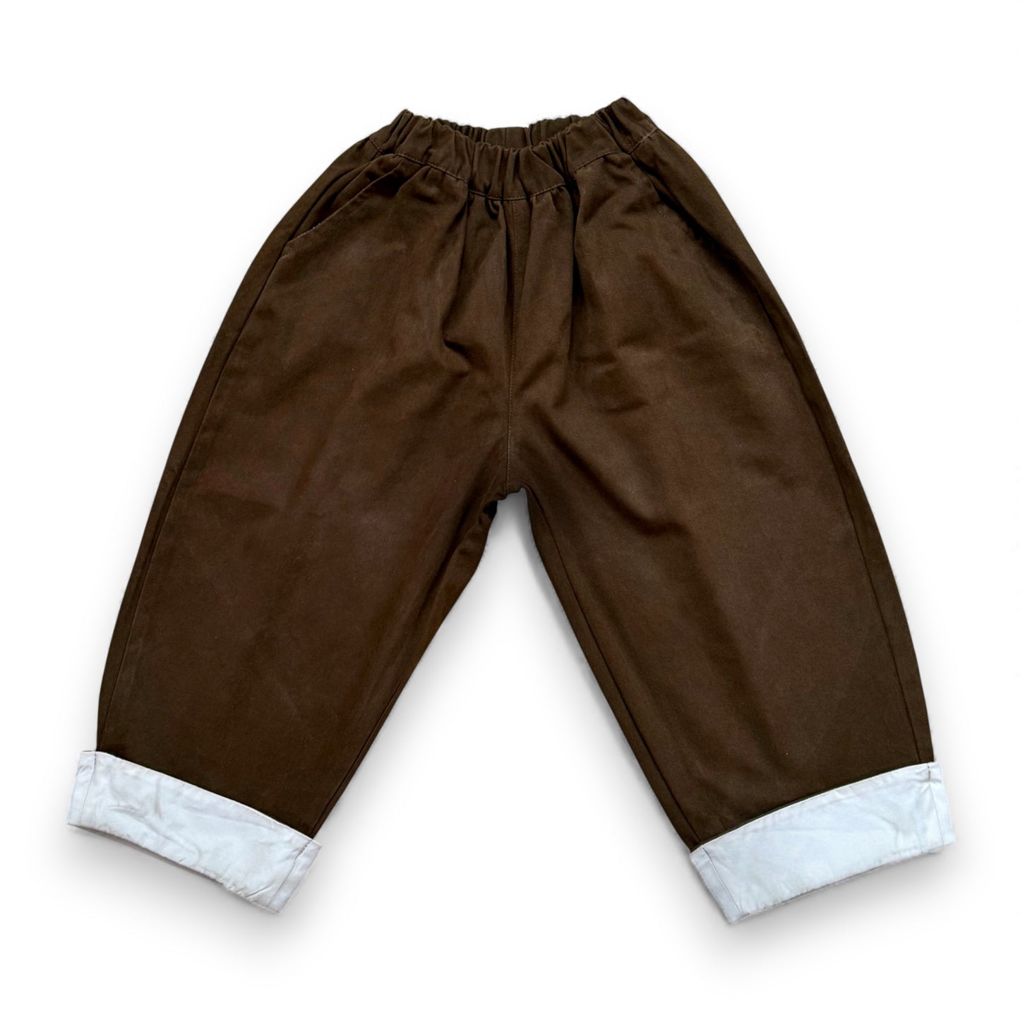 Voluminous cotton balloon trousers with contrast turn-up hem and elasticated waistband.