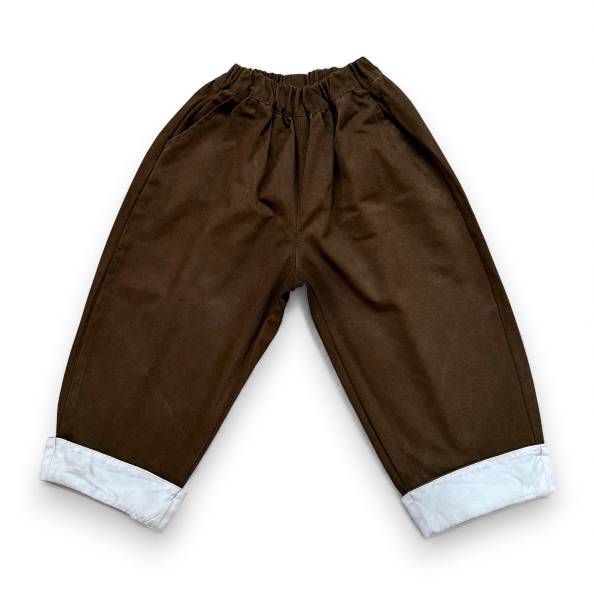 Voluminous cotton balloon trousers with contrast turn-up hem and elasticated waistband.