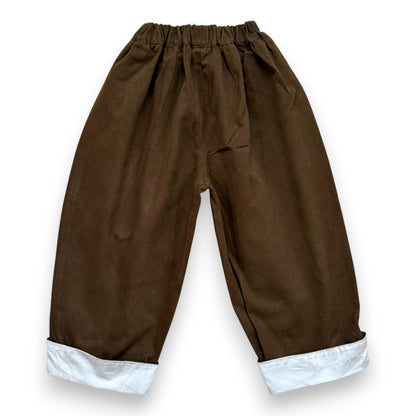 Voluminous cotton balloon trousers with contrast turn-up hem and elasticated waistband. - Back View