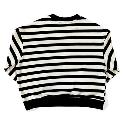 Back view of a black-and-cream striped cotton jersey jumper with drop shoulders and a cropped, boxy fit.