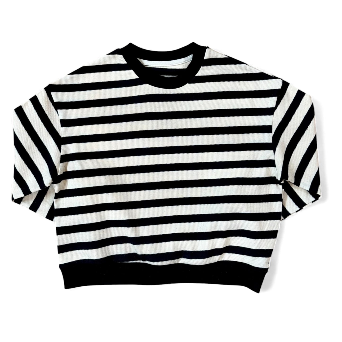 Front view of a black-and-cream striped cotton jersey jumper with ribbed neckline and a relaxed, boxy silhouette.