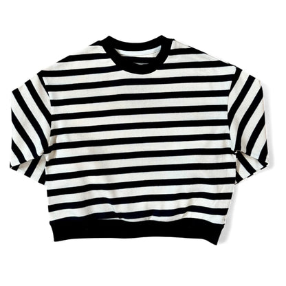 Front view of a black-and-cream striped cotton jersey jumper with ribbed neckline and a relaxed, boxy silhouette.