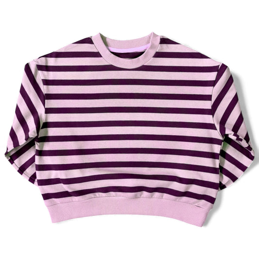 Front view of a lilac-and-purple striped cotton jersey jumper with ribbed neckline and relaxed drop-shoulder sleeves.