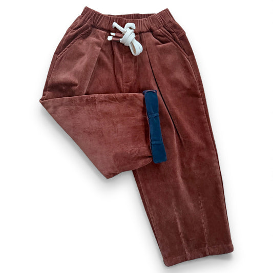 Folded view showing fleece lining of corduroy trousers