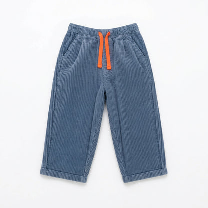 Zoale Cords by That’s Not Fair London, blue corduroy children’s trousers with a relaxed leg, elasticated waistband and contrast colour drawstring.